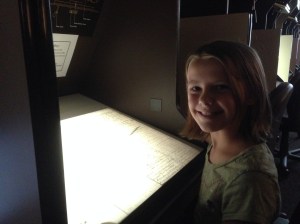 Ellie at a microfilm reader in the FHL